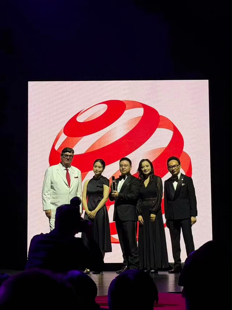 KIVRO team on stage receiving the Red Dot: Best of the Best award at the Capitol Theatre, Singapore
