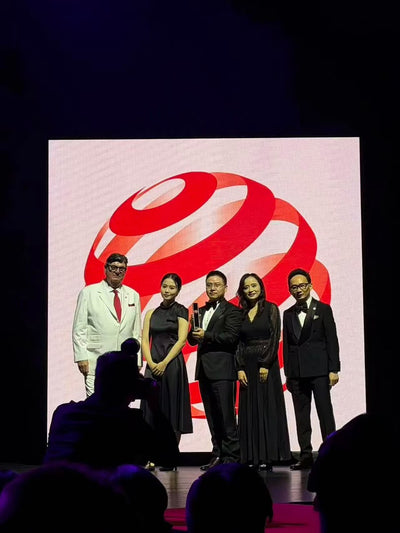 KIVRO team on stage receiving the Red Dot: Best of the Best award at the Capitol Theatre, Singapore