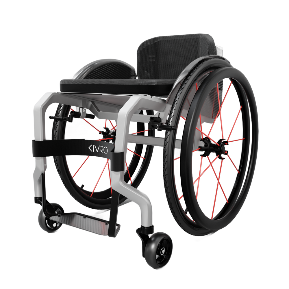 KIVRO custom 3D-printed titanium wheelchair, three-quarter view showing the weld-free frame and red-spoked wheels.